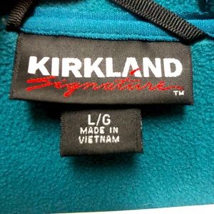 Women’s teal, zip up jacket.